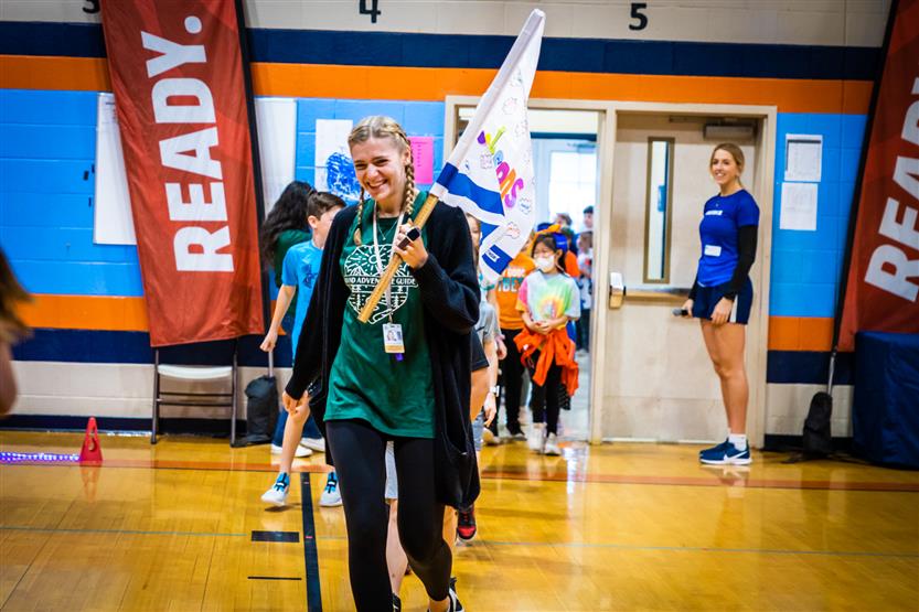 Students and families participate in a fun run
